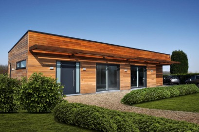 Woning met hout, zink en baksteen
